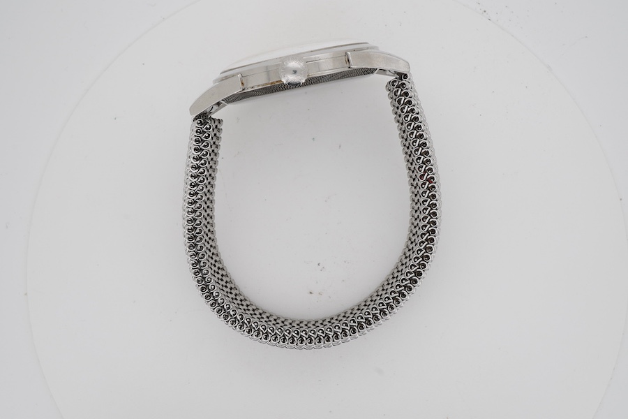 A gentleman's stainless steel Longines manual wind wrist watch, with baton and quarterly Arabic numerals and subsidiary seconds, case diameter 35mm, on an associated flexible strap.